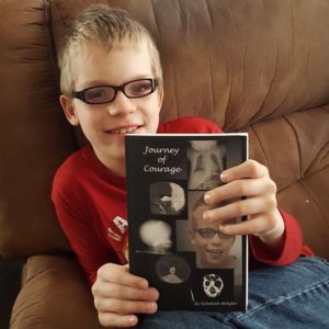Robby With JOC Book